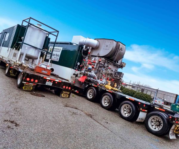 Trucks transporting mobile boiler room rentals