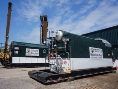 trailer mounted watertube 60000 PPH boilers in front of building